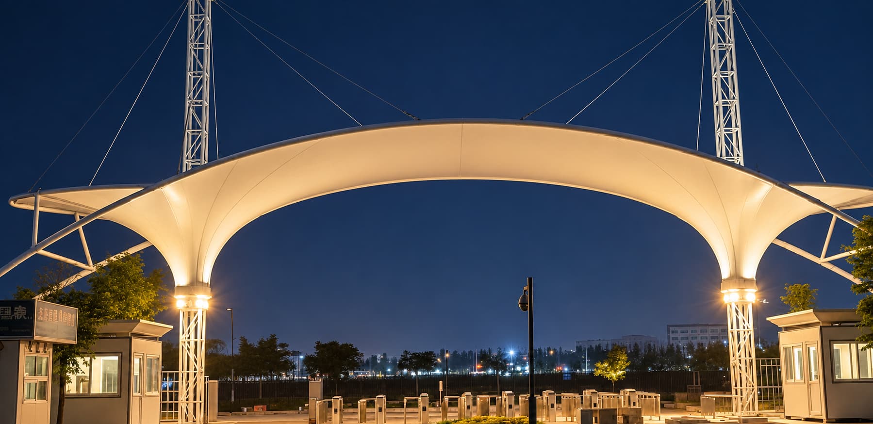 Reliance entrance canopy illuminated from below in an evening view