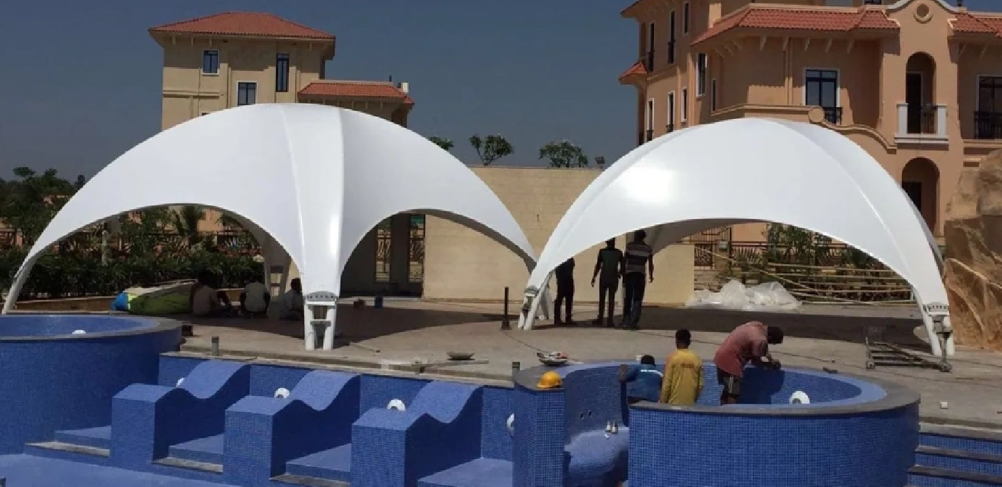 Tensile Dome Structure near Swimming Pool Seating Area